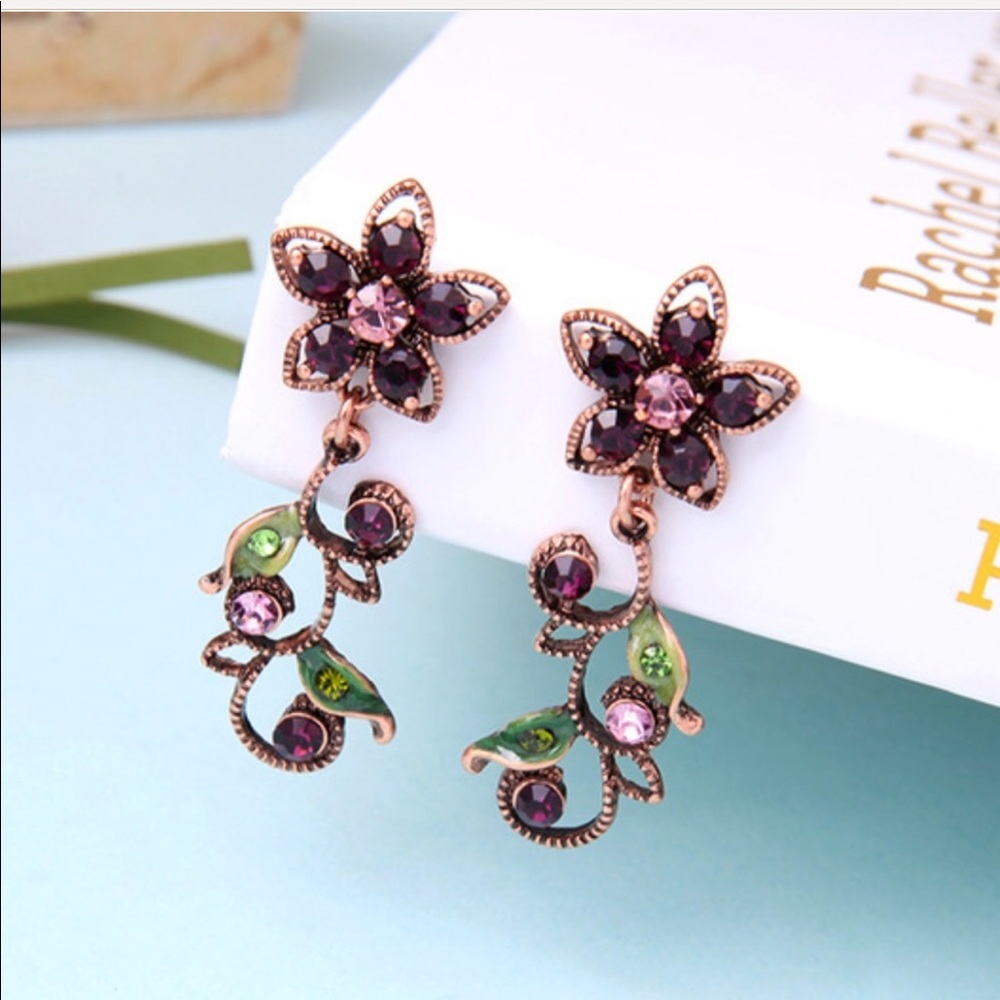 NWTs Eye Candy Violet Crystal Earrings 2”H .75”W